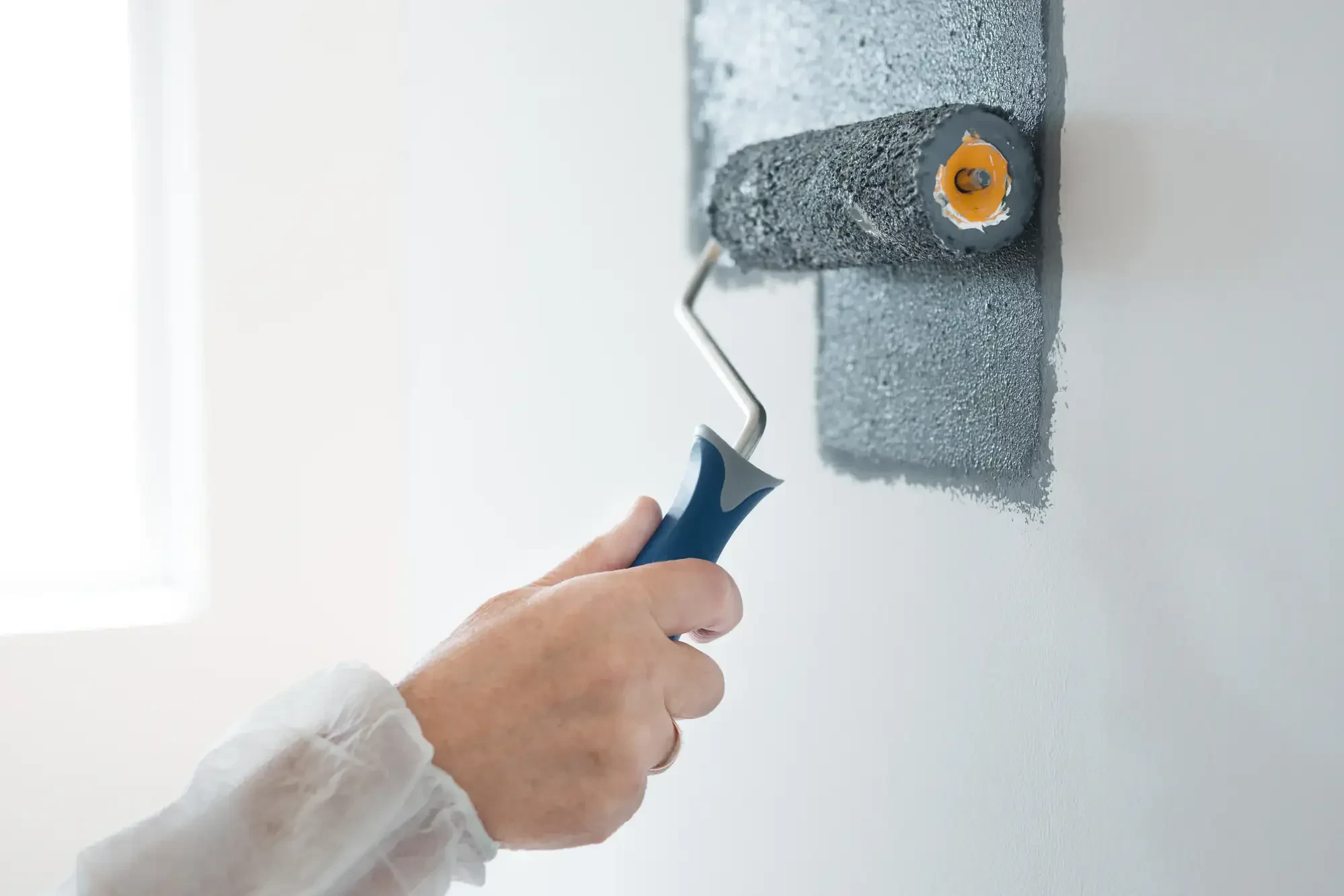 Professional gray wall roller painting essex county massachusetts service provided in Essex, Massachusetts with quality workmanship and attention to detail.