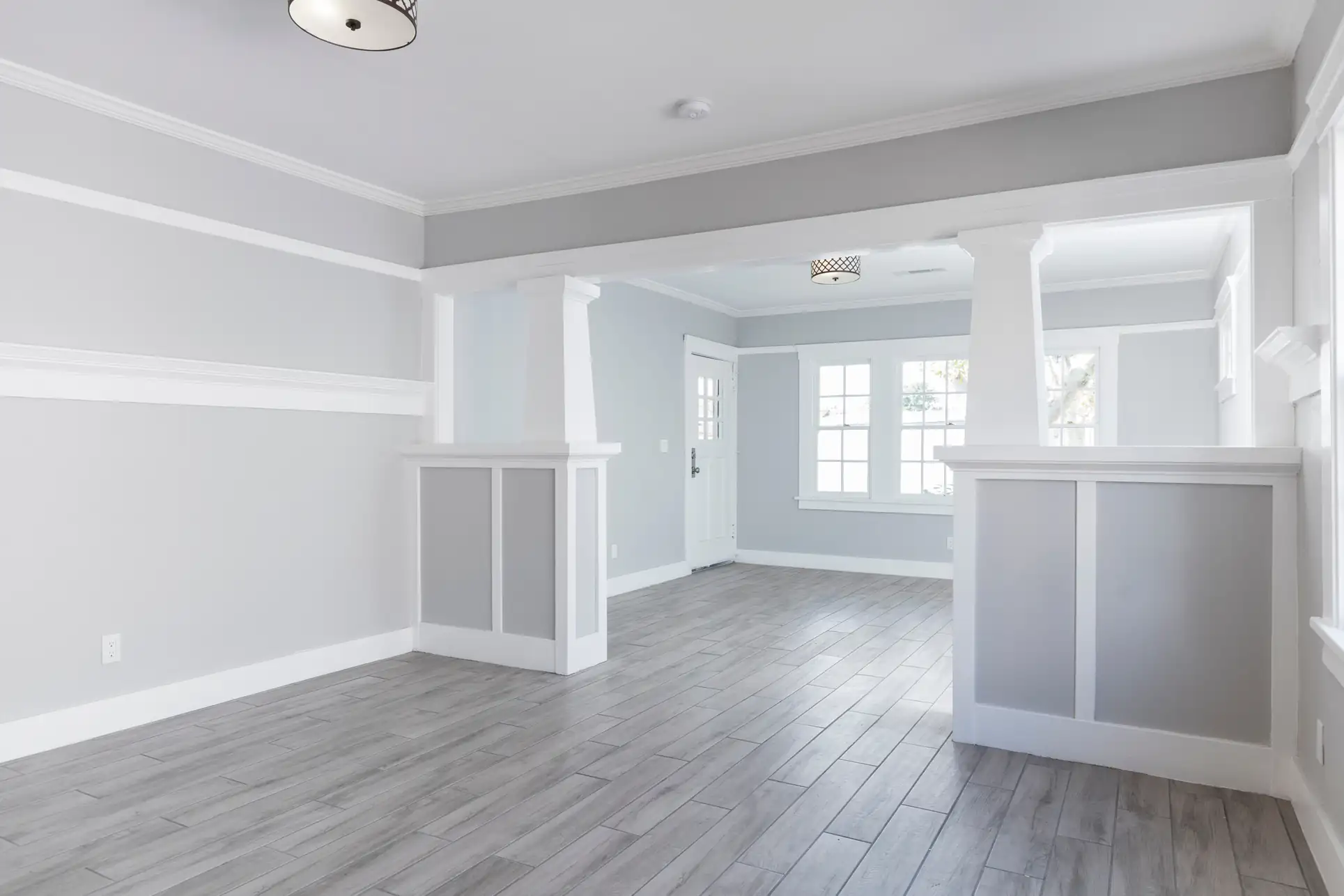 Fine Coat Painters brings a fresh, modern gray interior look to Essex County, MA, enhancing your home’s ambiance with professional painting services and exceptional attention to detail
